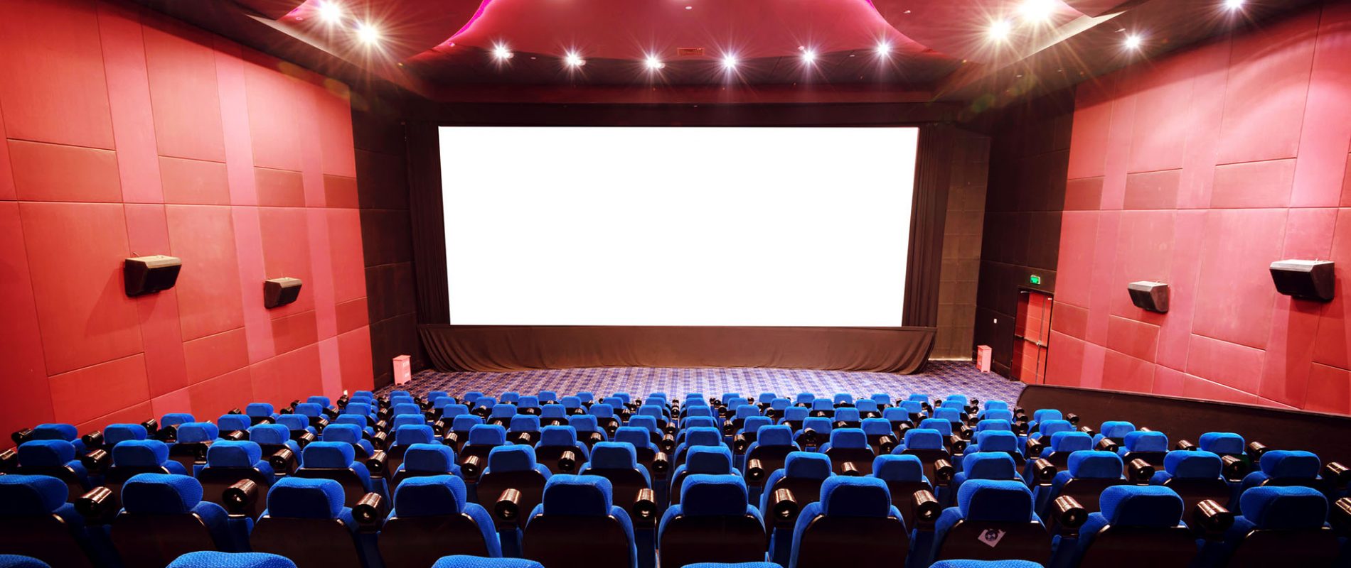 Empty movie theater with red seats
